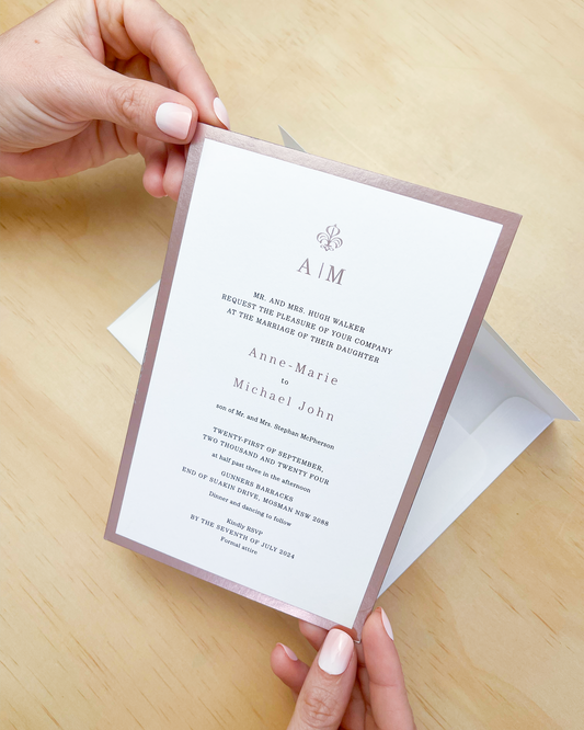 Duet Wedding Invitation shown highlighting rose foil. A design by Communique Design.