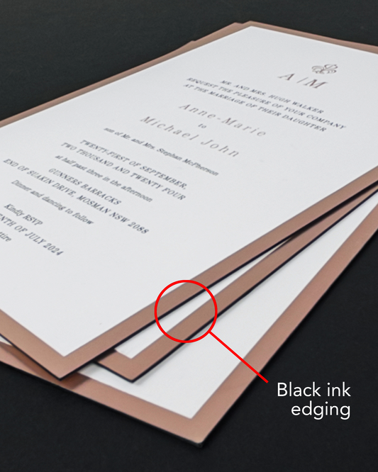 A close-up of our Duet Rose Foil wedding invitation with a red circle and arrow highlight the black ink edging along the edge of the card.