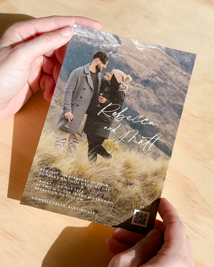 Engagement photo wedding invitation with romantic script typography overlay, printed on luxurious 600gsm textured card stock with white envelope – The Two Hearts Collection by Communique Design